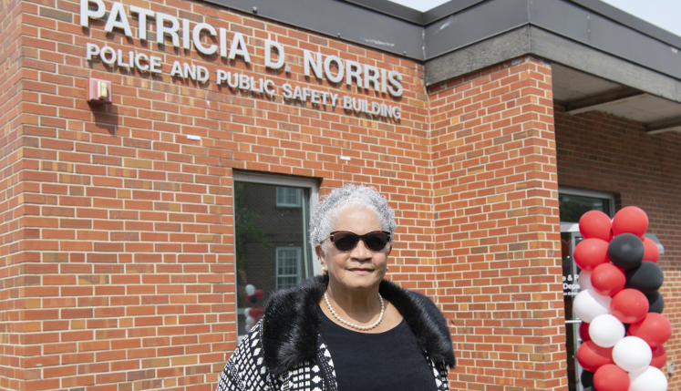  Patricia Norris standing in front of her namesake