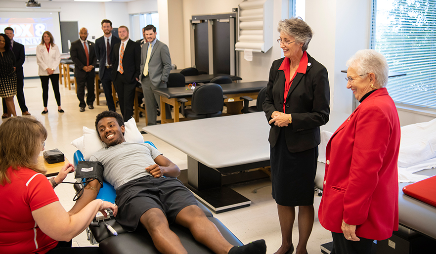 Congresswoman Foxx watches a physical therapy patient demonstration