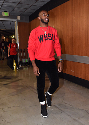 Chris Paul in hallway with cameras around him