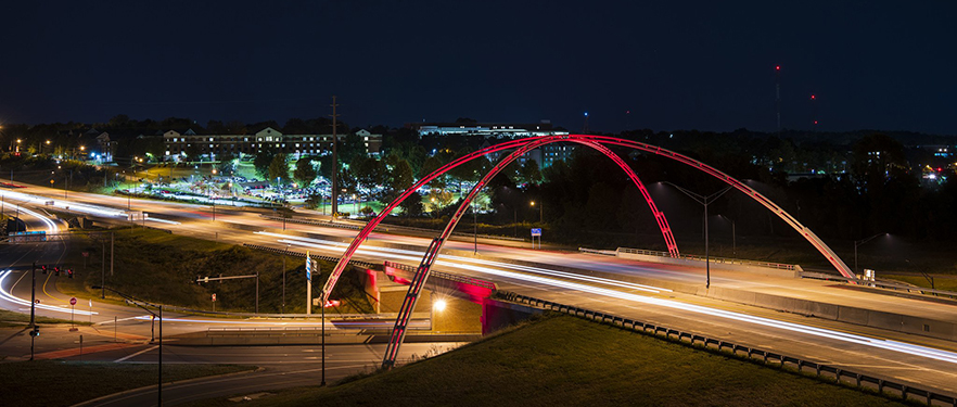 arches with the campus in the background.