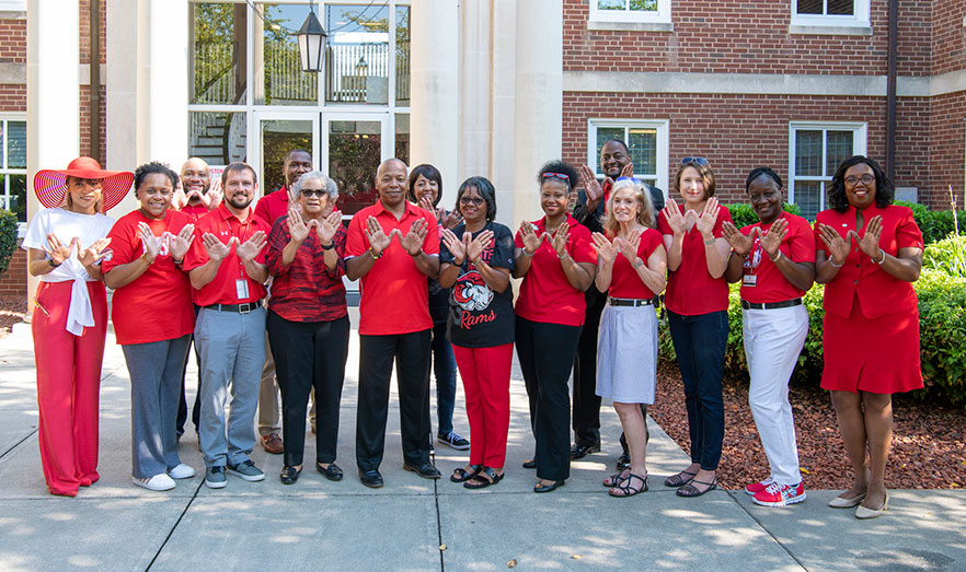 staff wearing red outside Blair Hall