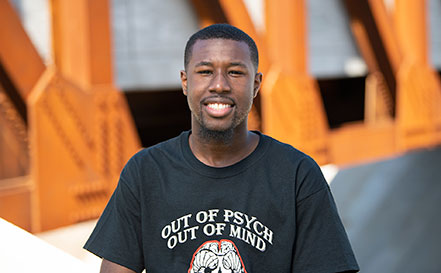 Semaj Capers with the Lowery Street bridge behind him.