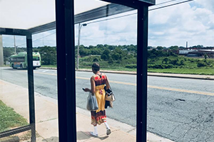 lady at a bus stop