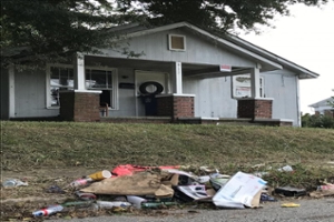 a house with junk outside of it