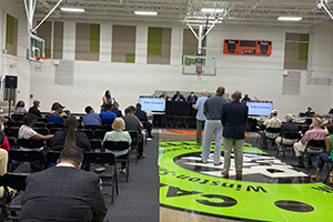 Citizens stand up to speak at an Aug. 19 meeting at the Carl Russell Community Center on combating gun violence.