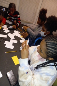 Small children playing with crafts.