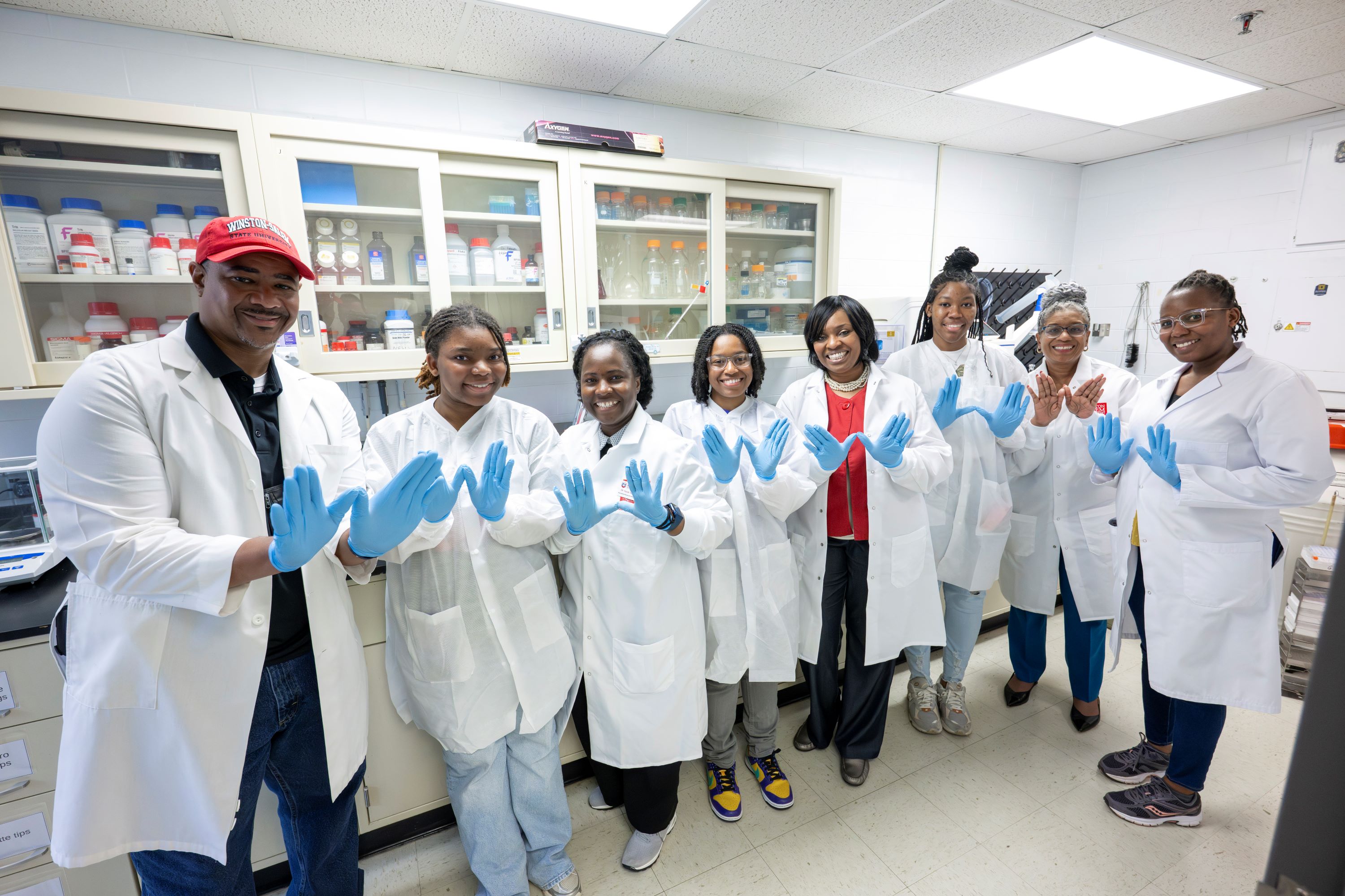 Group pictures with Chancellor Brown, researchers, and students