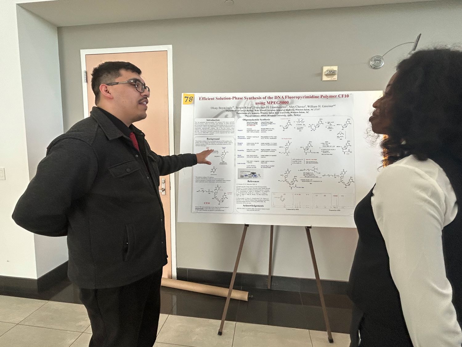 Judge points to researcher while speaking to a student