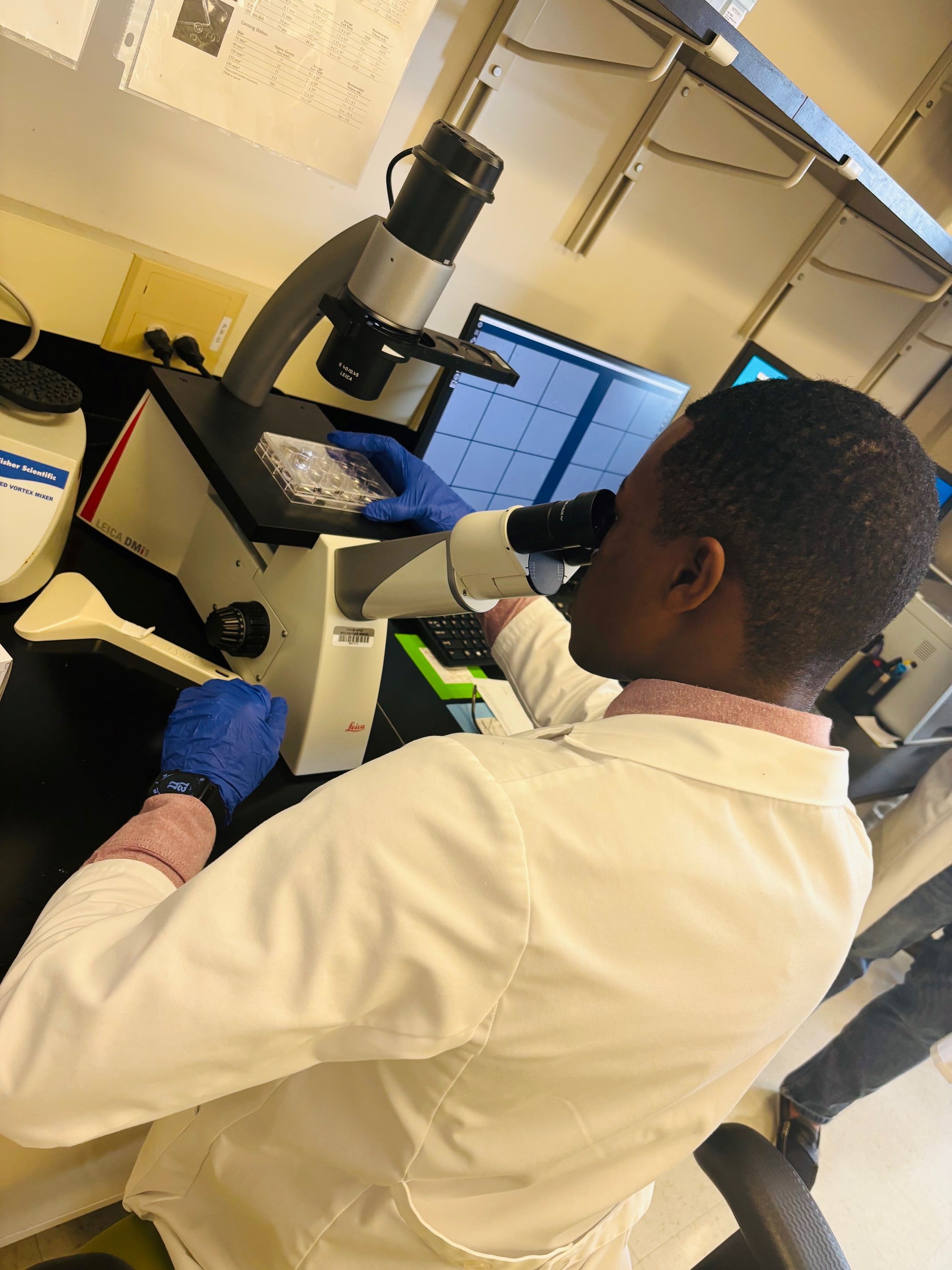 Student and microscope