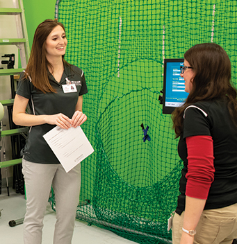 people talking in front of a green screen